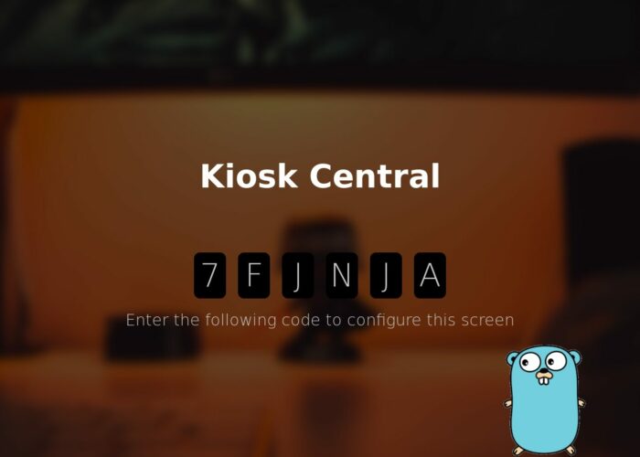 Blurry oranje-zwart beeld met tekst "Kiosk Central", een code van 6 krakters, wat meer losse tekst, en de Golang mascotte